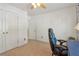 Bedroom with lots of natural light, built-in desk, and a modern ceiling fan at 959 Cedar Falls Sw Ct, Lilburn, GA 30047