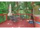 Outdoor deck with a seating area in a tranquil setting at 959 Cedar Falls Sw Ct, Lilburn, GA 30047