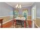 Bright dining room with natural light, featuring a neutral color scheme and views of the backyard at 959 Cedar Falls Sw Ct, Lilburn, GA 30047