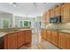 Spacious kitchen with granite countertops, stainless steel appliances, and hardwood flooring at 959 Cedar Falls Sw Ct, Lilburn, GA 30047