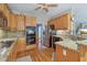 Modern kitchen features granite countertops, stainless appliances, and abundant cabinet space at 959 Cedar Falls Sw Ct, Lilburn, GA 30047