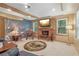 Inviting living room with fireplace, wood beams, and windows for natural light at 959 Cedar Falls Sw Ct, Lilburn, GA 30047
