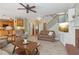 Inviting living room featuring a fireplace, staircase, and open access to kitchen at 959 Cedar Falls Sw Ct, Lilburn, GA 30047