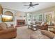 Comfortable living room featuring a fireplace, built-in shelves, and ample natural light at 959 Cedar Falls Sw Ct, Lilburn, GA 30047