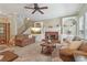 Cozy living room with a fireplace, built-in shelves, and comfortable seating at 959 Cedar Falls Sw Ct, Lilburn, GA 30047