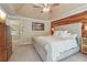 Comfortable main bedroom with a neutral color palette and a large upholstered headboard at 959 Cedar Falls Sw Ct, Lilburn, GA 30047
