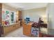 Bright home office with custom built-ins, large window, and comfortable seating at 959 Cedar Falls Sw Ct, Lilburn, GA 30047