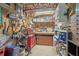 Organized and brightly lit storage area with shelving units and a workbench at 959 Cedar Falls Sw Ct, Lilburn, GA 30047