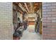 Brick lined storage area with unfinished ceiling and many shelving units at 959 Cedar Falls Sw Ct, Lilburn, GA 30047