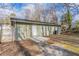 Exterior back of home featuring siding, trees, and concrete patio at 2366 Forrest Park Se Rd, Atlanta, GA 30315