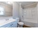 Bathroom with a white vanity, updated fixtures, and shower-tub combination at 2366 Forrest Park Se Rd, Atlanta, GA 30315