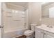 Clean bathroom featuring a shower-tub combo and a white vanity at 2366 Forrest Park Se Rd, Atlanta, GA 30315