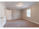 Bedroom featuring neutral walls, carpet and large double door closet at 2366 Forrest Park Se Rd, Atlanta, GA 30315