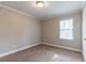 Bedroom featuring neutral walls and carpet with a window view at 2366 Forrest Park Se Rd, Atlanta, GA 30315