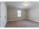 Bedroom featuring neutral walls, carpeted floor, and a single window at 2366 Forrest Park Se Rd, Atlanta, GA 30315