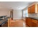 Bright kitchen area featuring hardwood floors, stainless steel appliances, granite countertops, and double sinks at 2366 Forrest Park Se Rd, Atlanta, GA 30315