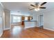 Open-concept layout with hardwood floors, ceiling fan, light walls, and an open entrance to another room at 2366 Forrest Park Se Rd, Atlanta, GA 30315