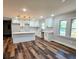 Modern kitchen featuring white shaker cabinets, quartz countertops, and an island at 3284 Boring Rd, Decatur, GA 30034