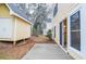 An exterior view of the backyard with a small storage building and sliding glass doors at 5084 Brittany Dr, Stone Mountain, GA 30083