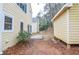 A view of the backyard with a small storage building on the side at 5084 Brittany Dr, Stone Mountain, GA 30083