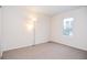 Bedroom with plush carpeting, neutral paint and a modern lighting fixture at 5084 Brittany Dr, Stone Mountain, GA 30083