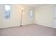 Bright bedroom with neutral carpeting, and two windows providing natural light at 5084 Brittany Dr, Stone Mountain, GA 30083