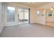 Bright dining area with neutral carpet and sliding door access to the backyard at 5084 Brittany Dr, Stone Mountain, GA 30083