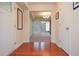 Inviting entryway with hardwood floors and a view to the dining area at 5084 Brittany Dr, Stone Mountain, GA 30083