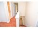 Hallway with hardwood floors leading to multiple rooms, including a staircase at 5084 Brittany Dr, Stone Mountain, GA 30083