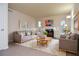 Staged living room with fireplace, modern furniture, and ample natural light at 5084 Brittany Dr, Stone Mountain, GA 30083