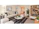 Staged living room featuring a bookshelf, modern furniture, and neutral carpet at 5084 Brittany Dr, Stone Mountain, GA 30083