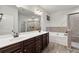 Double vanity bathroom with soaking tub and glass shower at 554 Lance View Ln, Lawrenceville, GA 30045