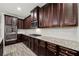 Modern kitchen with granite countertops and dark wood cabinets at 554 Lance View Ln, Lawrenceville, GA 30045