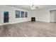 Spacious living room with fireplace and wood-look flooring at 554 Lance View Ln, Lawrenceville, GA 30045