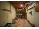 Unfinished basement with exposed pipes and shelving, offering storage and utility space at 830 Montego Sw Way, Lilburn, GA 30047