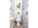 Bathroom with a toilet, shower, and shelves at 830 Montego Sw Way, Lilburn, GA 30047