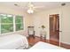 Bedroom with two twin beds, ceiling fan, a chair and a window at 830 Montego Sw Way, Lilburn, GA 30047
