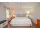 Spacious primary bedroom with beautiful hardwood floors and ample natural light at 830 Montego Sw Way, Lilburn, GA 30047