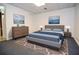 Cozy bedroom with serene decor, features a comfortable bed, dresser, and tasteful wall art at 830 Montego Sw Way, Lilburn, GA 30047