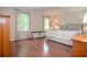 Primary bedroom with hardwood floors, a ceiling fan, and abundant natural light at 830 Montego Sw Way, Lilburn, GA 30047