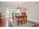 Cozy dining room featuring hardwood floors, natural light, and elegant decor at 830 Montego Sw Way, Lilburn, GA 30047