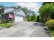 Charming home featuring a two-car garage and American flag, set amongst lush greenery at 830 Montego Sw Way, Lilburn, GA 30047