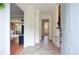 Inviting foyer with tile flooring, crown molding, and views into the living room and hallway at 830 Montego Sw Way, Lilburn, GA 30047