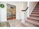 Spacious foyer featuring tile flooring, a staircase, and an open view into the adjacent living area at 830 Montego Sw Way, Lilburn, GA 30047