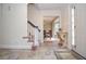 Inviting foyer featuring tile flooring, staircase, and elegant decor at 830 Montego Sw Way, Lilburn, GA 30047