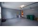 Spacious garage with light gray walls, epoxy floor, and ample storage, providing parking and utility at 830 Montego Sw Way, Lilburn, GA 30047