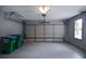 Spacious painted two car garage with automatic door and large windows at 830 Montego Sw Way, Lilburn, GA 30047