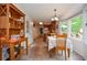 Bright eat-in kitchen with tile flooring and breakfast area features large windows overlooking the backyard at 830 Montego Sw Way, Lilburn, GA 30047