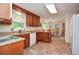 Bright eat-in kitchen with wood cabinets, granite countertops and tile floors at 830 Montego Sw Way, Lilburn, GA 30047