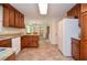 Open kitchen featuring tile floors, ample storage and modern appliances at 830 Montego Sw Way, Lilburn, GA 30047